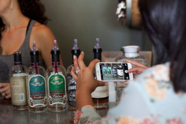 a person holding a bottle of wine